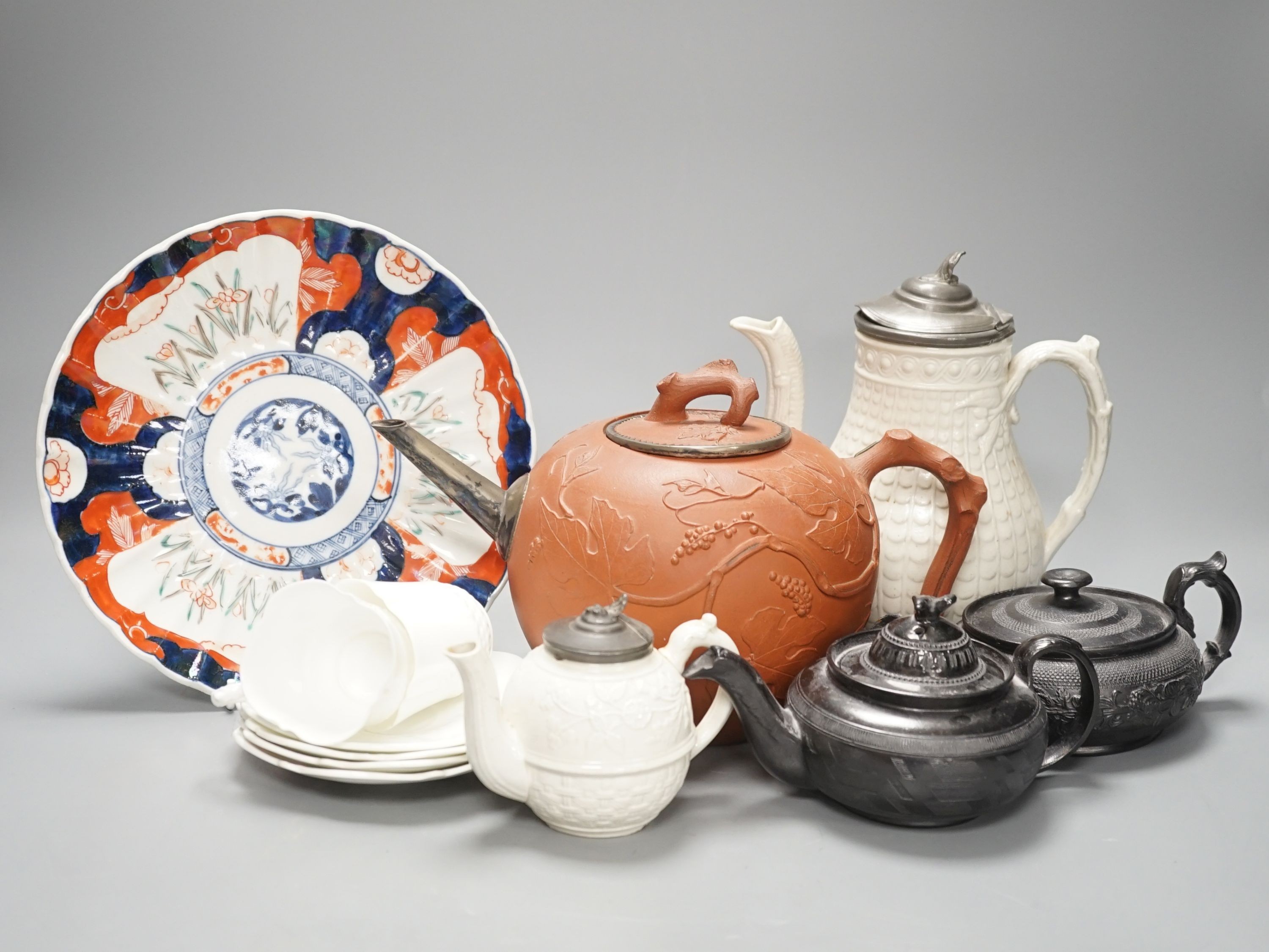 Four 19th century black basalt or black glazed pottery teapots, a large red ware teapot, a creamware dish and a Royal Worcester pot pourri, and other ceramics, tallest 27.5cm
